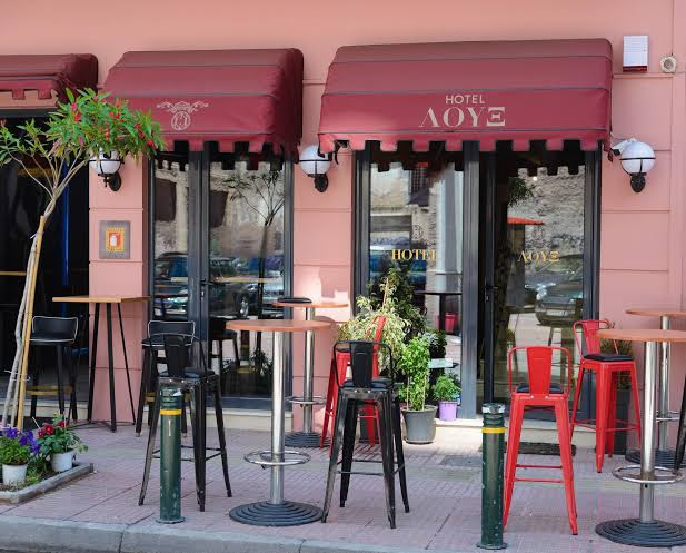 Athens hotel entrance with street seating