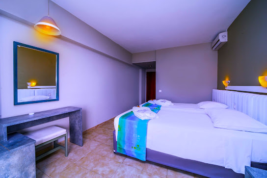 Hotel room in Athens lit in purple