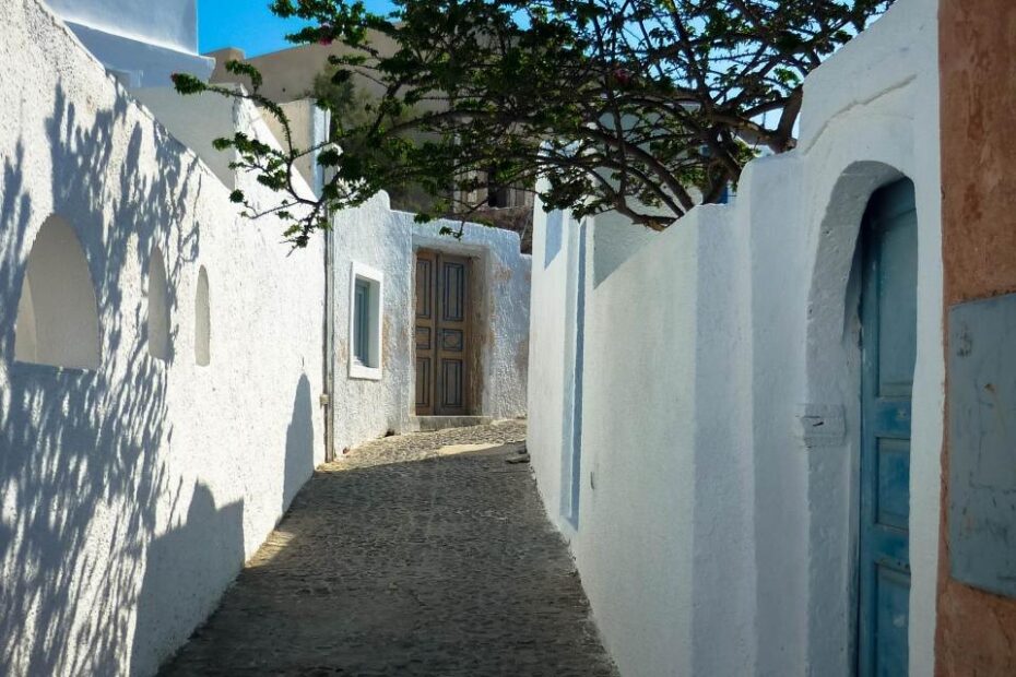 Quiet whitewashed alley on Santorini