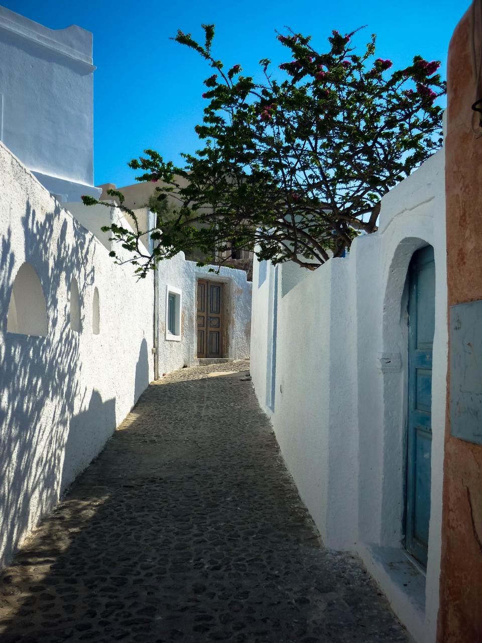 Quiet whitewashed alley on Santorini