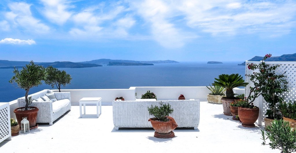 Villa terrace with seating overlooking the Santorini caldera